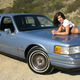 Illustration for article titled How To Use Half-Naked Women To Sell A 1990 Lincoln Town Car